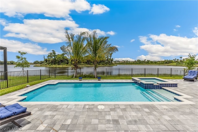 view of swimming pool with an in ground hot tub, a water view, and a patio area