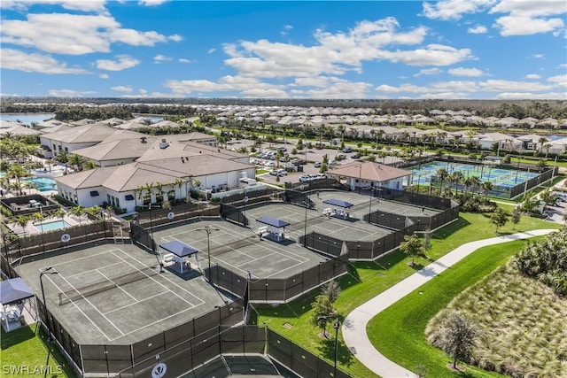 birds eye view of property with a residential view