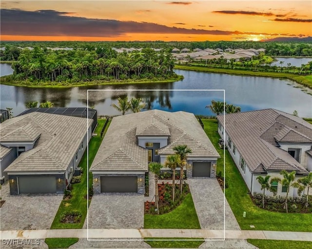 12043 Datura Pl, Naples, FL 34120 - aerial view at dusk with a water view