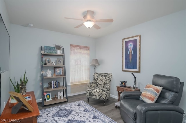 sitting room featuring hardwood / wood-style floors and ceiling fan