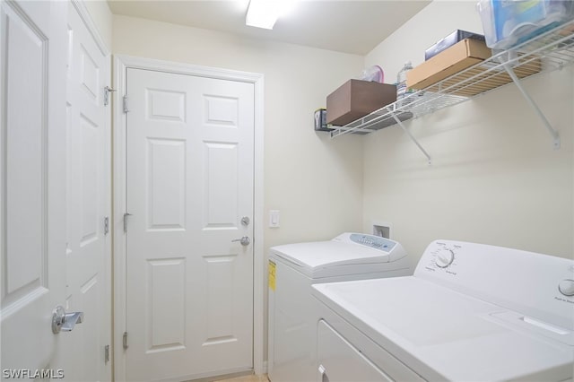 laundry room with independent washer and dryer