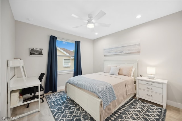 bedroom featuring ceiling fan and hardwood / wood-style floors