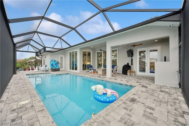 1641 Orleans Ct, Marco Island, FL 34145 - swimming pool with french doors, a patio, ceiling fan, and glass enclosure