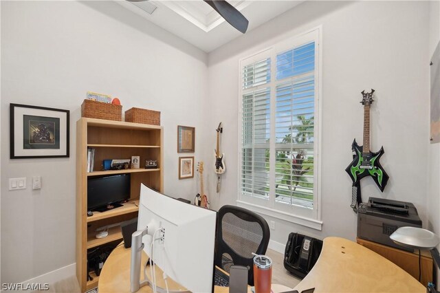 1641 Orleans Ct, Marco Island, FL 34145 - home office featuring baseboards, healthy amount of natural light, wood finished floors, and a skylight
