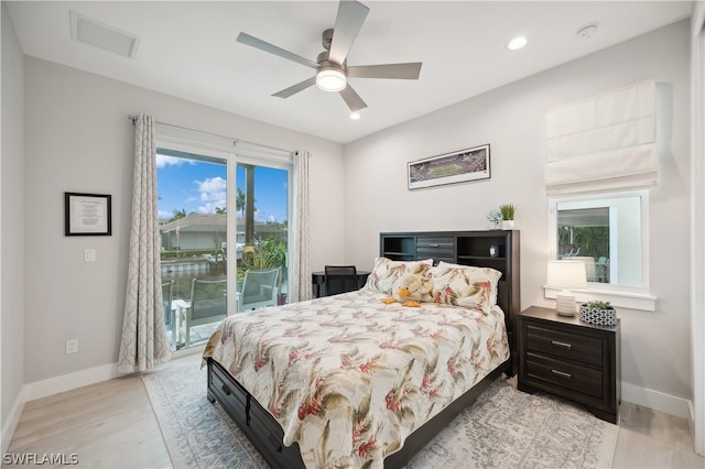 bedroom featuring ceiling fan, light wood-type flooring, and access to outside