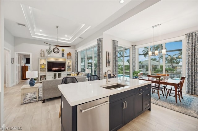 1641 Orleans Ct, Marco Island, FL 34145 - kitchen featuring a sink, dishwasher, light wood-type flooring, light countertops, and recessed lighting