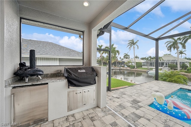 sunroom with a water view