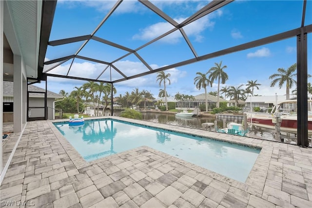 1641 Orleans Ct, Marco Island, FL 34145 - swimming pool featuring a patio, a lanai, and a water view