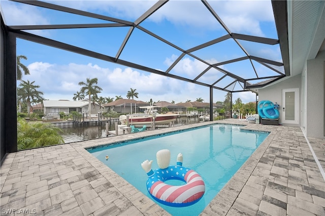 view of swimming pool featuring a patio area, a boat dock, and a lanai