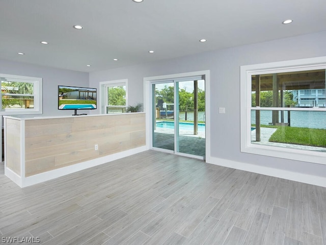 unfurnished living room with light hardwood / wood-style floors