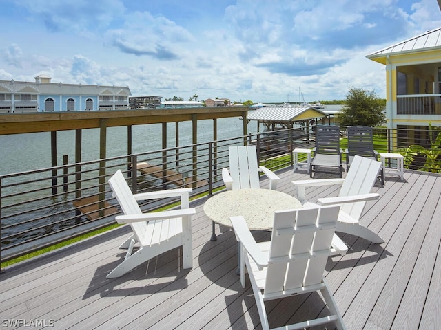 wooden deck featuring a water view