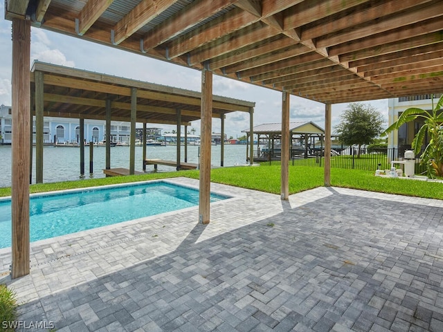 view of pool featuring a gazebo, a water view, and a lawn