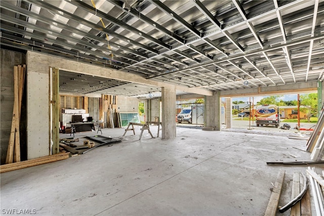 interior space featuring plenty of natural light and concrete floors