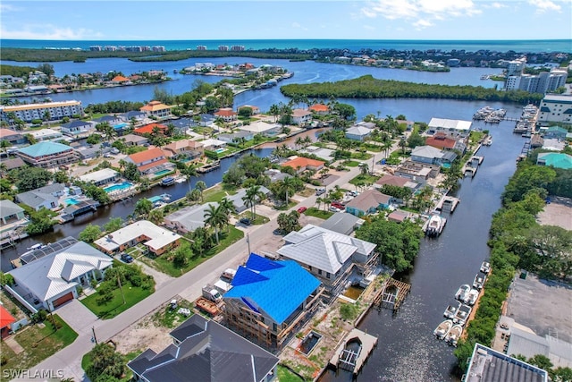 bird's eye view with a water view