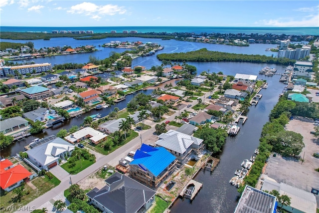 bird's eye view with a water view