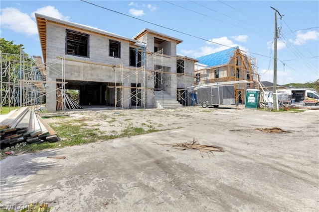 back of property featuring a balcony