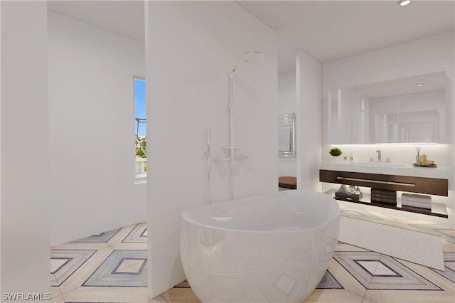 bathroom with a bathing tub and vanity