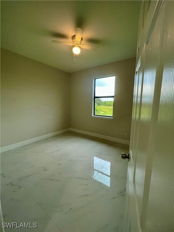 unfurnished room with ceiling fan