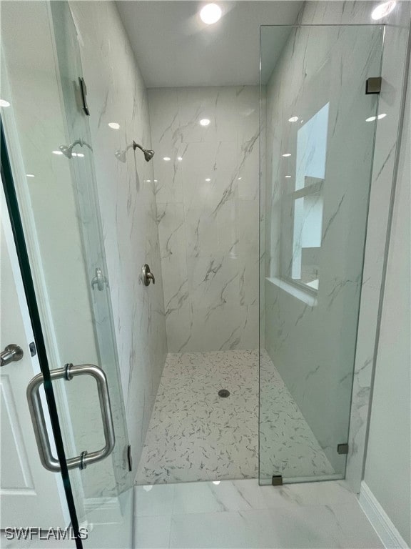 bathroom featuring an enclosed shower