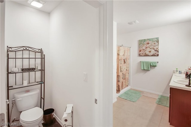 bathroom featuring curtained shower, vanity, and toilet