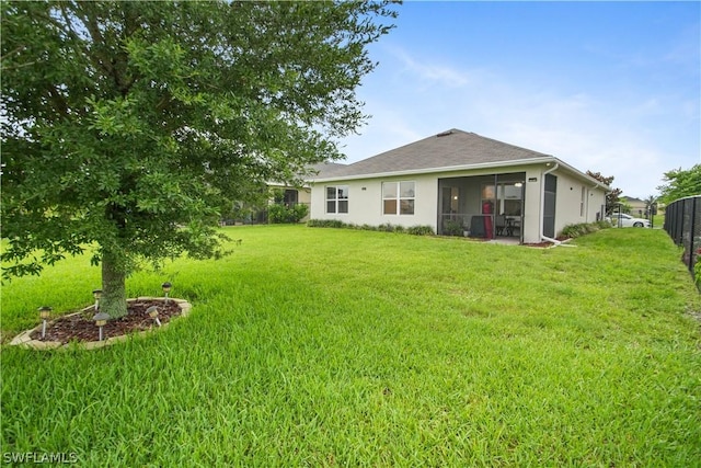 view of yard with a sunroom