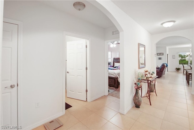 corridor with light tile patterned floors