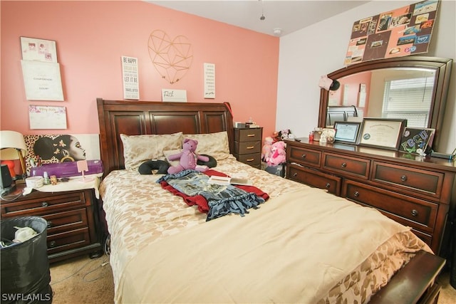 bedroom featuring light colored carpet