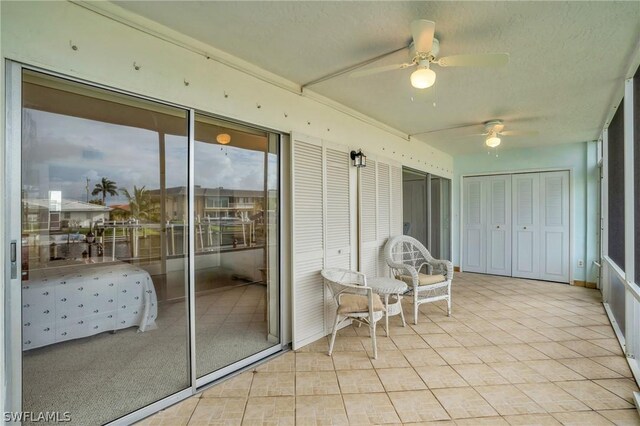 sunroom / solarium with ceiling fan