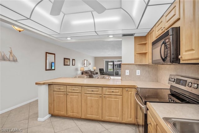 kitchen with kitchen peninsula, decorative backsplash, electric stove, light brown cabinets, and light tile patterned floors