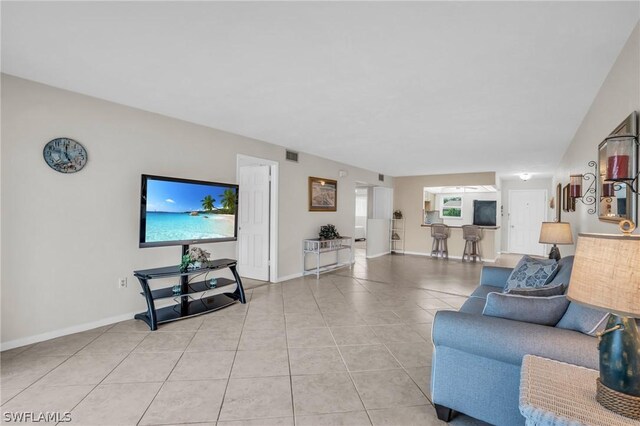 living room with light tile patterned floors