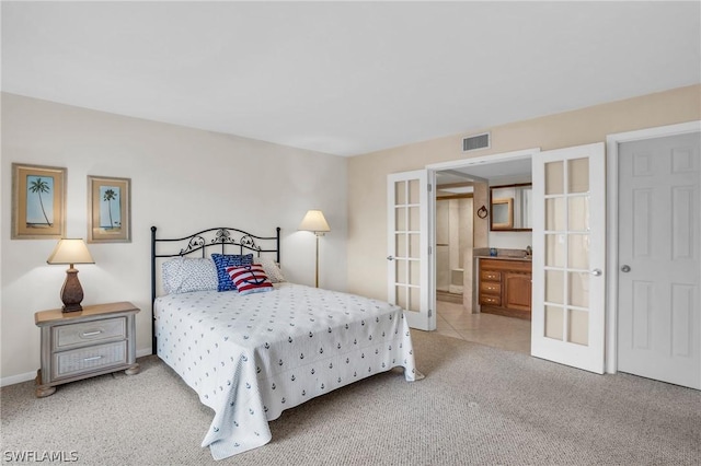 bedroom with light carpet and french doors