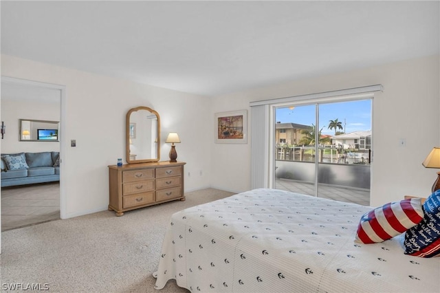 bedroom featuring light carpet