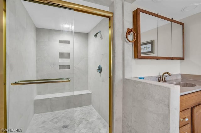 bathroom featuring vanity and an enclosed shower