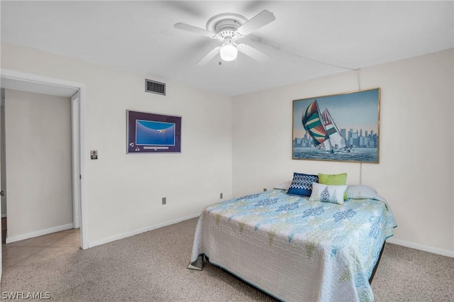 bedroom featuring light carpet and ceiling fan