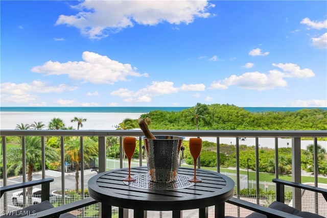 balcony featuring a water view