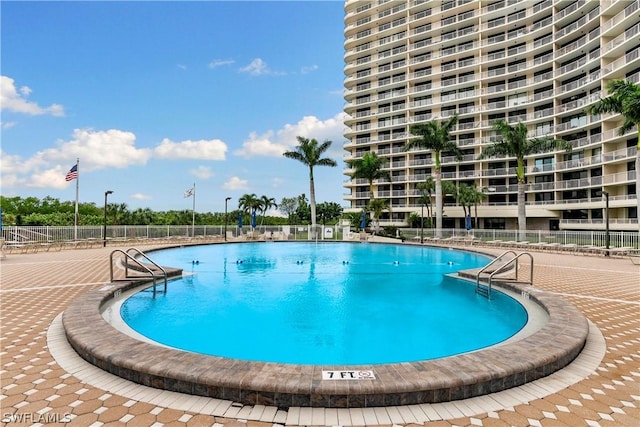 view of swimming pool with a patio