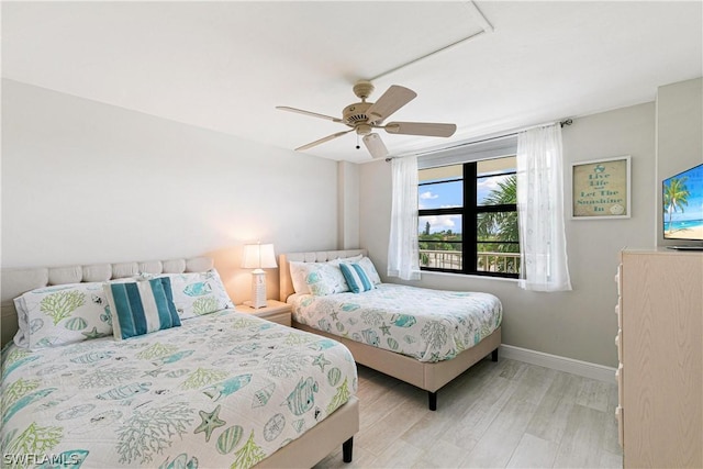 bedroom featuring ceiling fan and light hardwood / wood-style floors