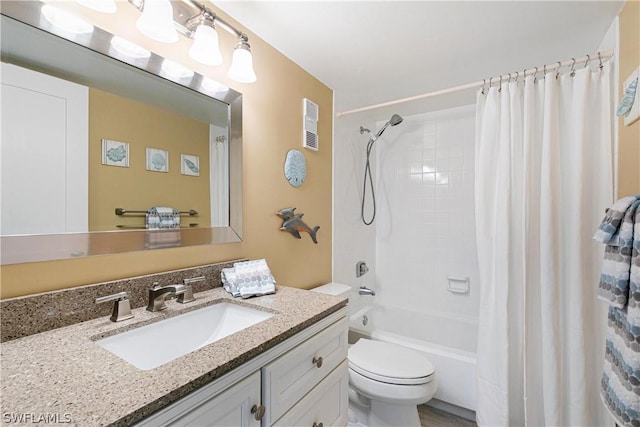 full bathroom featuring toilet, vanity, and shower / tub combo with curtain