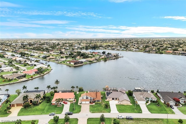 bird's eye view featuring a water view and a residential view