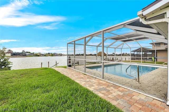 pool featuring a lanai, a water view, a yard, and a patio