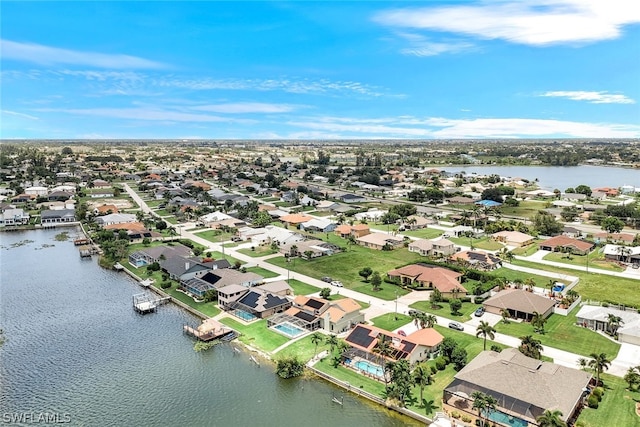 bird's eye view featuring a water view and a residential view