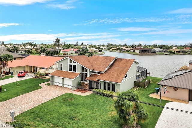 bird's eye view with a water view and a residential view