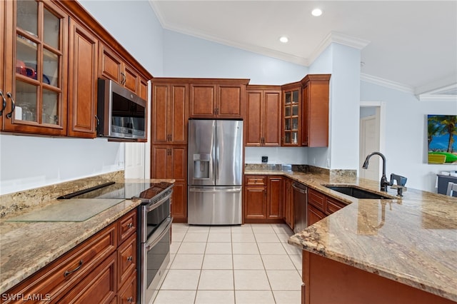 kitchen featuring stainless steel appliances, light stone countertops, lofted ceiling, and sink