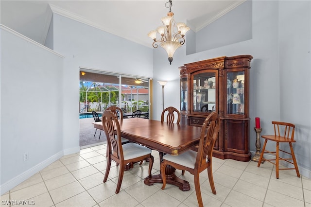 dining area with crown molding, a towering ceiling, and light tile patterned floors