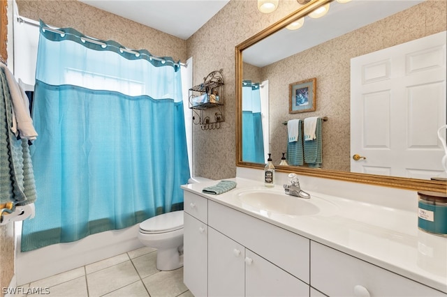 full bathroom featuring tile patterned flooring, vanity, toilet, and shower / bath combo