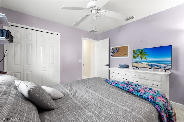 bedroom with ceiling fan and a closet