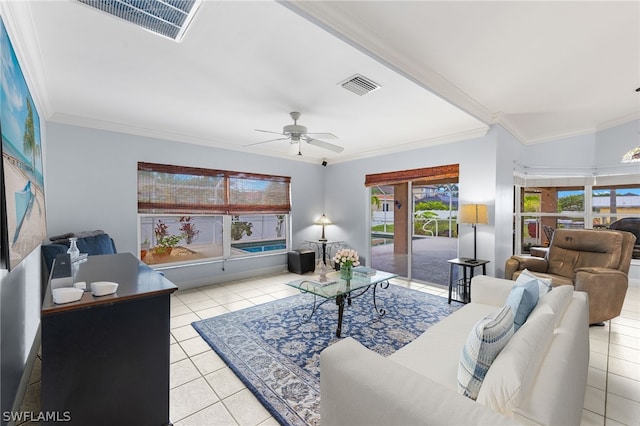 living room with crown molding, ceiling fan, vaulted ceiling, and light tile patterned floors