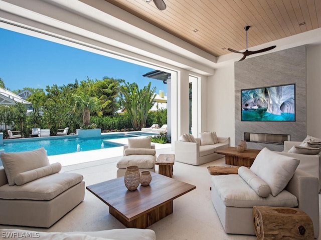 living room with ceiling fan and wooden ceiling