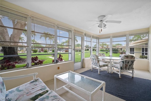 sunroom / solarium with ceiling fan