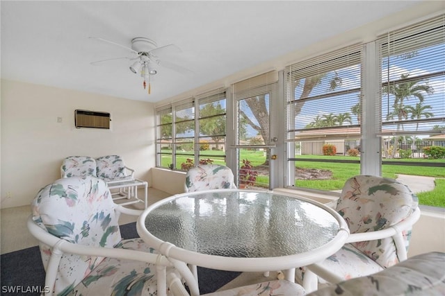 sunroom with ceiling fan